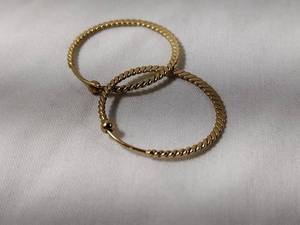 lot 33 image: Jewelry 14K yellow gold textured hoop earrings. Marked 14K Narco (Mexico)