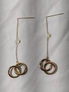 lot 35 image: Jewelry 14K yellow gold poststud double hoop earrings. Marked 14K JCM. Earrings 2.5L  (small dent in one hoop)