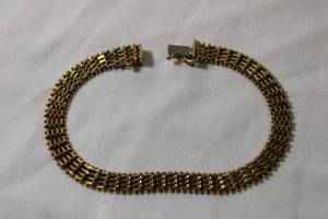 lot 54 image: Jewelry 14K yellow gold flexible square mesh bracelet w hidden clasp and safety clasp. Marked 14K IG USA(Imperial Gold). 7L
