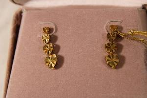 lot 75 image: Jewelry 14K yellow gold signed Beverly Hills Gold laser cut earrings. Marked 14K Beverly Hills. In box w booklet. Approx. 1L (Sterling version available in lot 68)