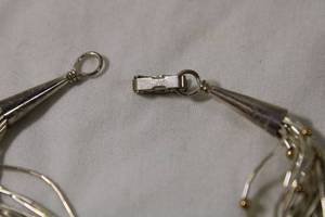 lot 99 image: Jewelry Sterling Silver Heishi (20) liquid silver bead strand bracelet. Marked 925 and Sterling. Fold over clasp. 7L