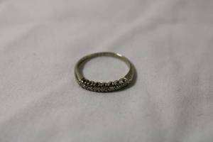 lot 59 image: Jewelry 18K white gold diamond ring. Marked 18K with anniversary inscription (1948). Size 5. Approx .70 carats. (Tested)