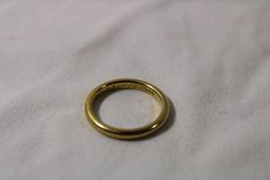 lot 62 image: Jewelry 18K yellow gold anniversary band (inscription circa 1918). Marked 18K S & F. Size 4.5