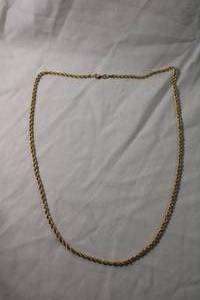 lot 64 image: Jewelry 14K yellow gold rope chain necklace. Marked 14K Peru EG (Eterna Gold). 21L
