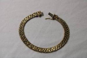 lot 76 image: Jewelry 14K yellow gold flexible square mesh bracelet w hidden clasp and safety clasp. Marked 14K IG USA(Imperial Gold). 7L