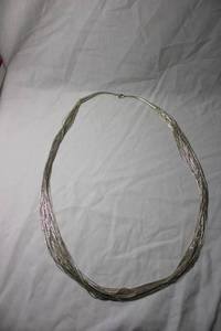 lot 80 image: Jewelry Sterling Silver Heishi liquid silver bead multi strand (30) necklace. Marked 925 and Sterling. 28L