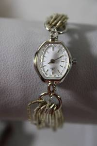 lot 90 image: Jewelry Sterling Silver Heishi (10) strand liquid silver bead watch band and quartz watch. Band marked 925 and Sterling. 7L