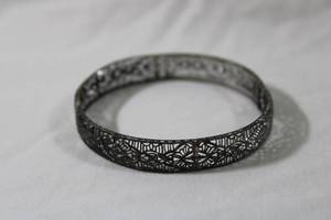 lot 94 image: Sterling Silver Victorian antique fine filigree hinged bracelet. Marked Sterling AMCO. (1935-1971,Always considered to be on the high-end of costume jewelry, AMCO jewelry was never cheap. Due to the company�s use of sterling silver and gold fill.)