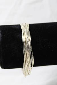 lot 152 image: Jewelry Sterling Silver Heishi (20) liquid silver bead strand bracelet. Marked Sterling. 7.5L
