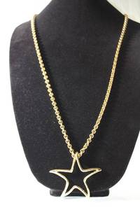 lot 155 image: Jewelry Signed Givenchy opera length 34L continuous necklace with star pendant. Marked Givenchy. Givenchy also available in lot 415.