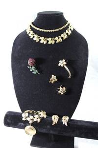 lot 159 image: Jewelry Signed jewelry. Includes a Boucher (Marcel Boucher 1930-1960) crystal brooch and earring set (missing a few white crystals on earrings), Schreiner Brooch with unusual 3D flower and Coro jewelry