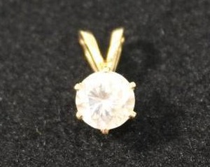 lot 167 image: Jewelry 14K yellow gold and white stone pendant. Marked 14K.