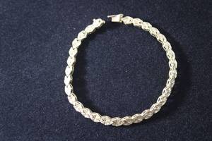 lot 171 image: Jewelry 14K yellow gold laser cut bracelet w box clasp and safety catch. Marked 14K. 7.5L