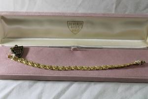 lot 174 image: Jewelry 14K signed Beverly Hills Gold laser cut bracelet. Marked 14K Beverly Hills Gold. Box clasp and safety catch. 7.5L. In box w booklet