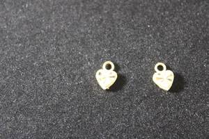 lot 177 image: Jewelry (2) 14K signed Beverly Hills Gold laser cut heart pendants. Marked 14K Beverly Hills Gold. (2 X The money)