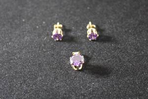 lot 178 image: Jewelry 14K yellow gold QVC Diamonique Tanzanite CZ pendant and matching poststud earrings. Marked 14K CZ DQ (Diamonique, Designer Quality, 3 pc set)