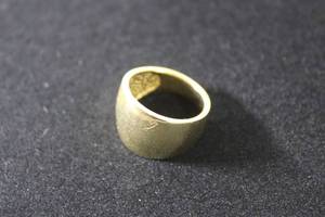 lot 180 image: Jewelry 14K yellow gold dome ring. Marked 14K. Size 7.5