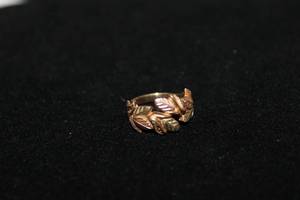 lot 195 image: Jewelry 10K tri-colored Black Hills Gold ring. Marked 10K CCO (Black Hills Gold By Coleman, Formally Coleman now Black Hills Gold by TRJ). Size 4.25