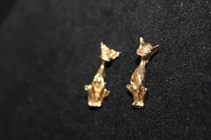 lot 306 image: (2) 14K yellow gold figural pendant in Egyptian Mau cat form. Marked 14K. 1L (X the money)