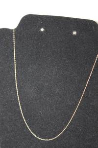 lot 312 image: 14K yellow gold cable chain necklace. Marked 14K. 18L