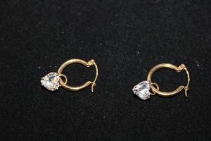 lot 313 image: 14K yellow gold hoop earrings with 14K yellow gold CZ caged heart earring dangles. Marked 14K DO CZ (QVC Diamonique). 34L
