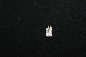 lot 314 image: 14K yellow gold white stone pendant. Marked 14K