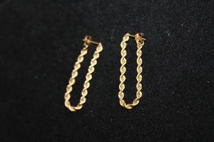 lot 316 image: 14K yellow gold flexible rope chain dangle earrings. Marked 14K. 1.5 drop
