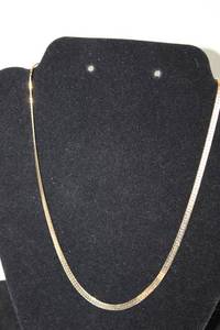 lot 320 image: 14K yellow gold flat serpentine necklace. Marked 14K Italy. 18.5L
