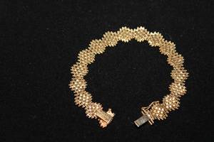 lot 323 image: 14K yellow gold flexible mesh link bracelet. Marked 14K IG (Imperial Gold). Box clasp w safety catch. 6.75L
