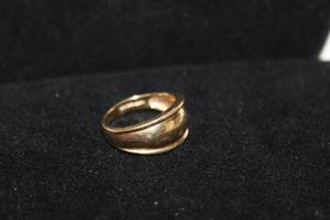 lot 328 image: 14K yellow gold domed ring. Marked 14K. Size 8