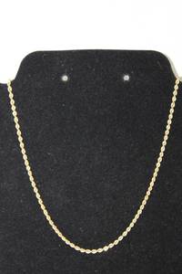 lot 329 image: 14K yellow gold twisted rope chain necklace. Marked 14K. Tube clasp w safety clasp. 16L