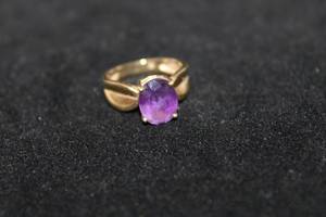 lot 332 image: 14K yellow gold and Amethyst gemstone ring. Marked 14K. Size 6. Amethyst tested.