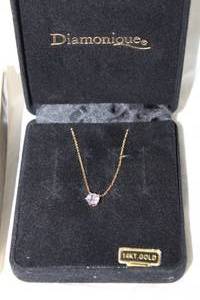 lot 336 image: 14K yellow gold cable chain necklace w attached 14K gold CZ pendant. Marked 14K Mexico. In original Morgan Fairchild Diamonique box. 18L More Morgan Fairchild available in Lot 254