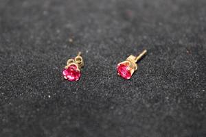 lot 344 image: 14K yellow gold and Ruby gemstone poststud earrings. Marked 14K. Rubies tested.