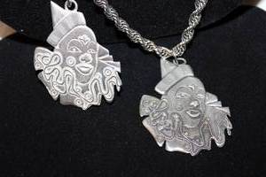lot 350 image: (2) large Webb Silver Company (Philadelphia, PA, 1970s) early American Pewter clown ChristmasHoliday ornaments on 36 and 40L necklaces. Unmarked.