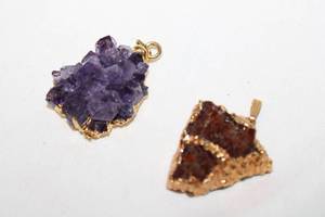 lot 358 image: (2) rough cut Amethyst specimens liquid gold framed pendants.