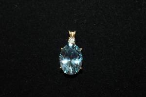 lot 363 image: 14K yellow gold Blue Quartz and CZ pendant. Marked 14K DO CZ (QVC Diamonique). Quartz tested. Approx 1L