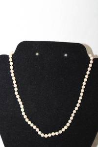lot 375 image: Cultured pearl strand with 83.5% Silver clasp. Marked 835. 14L (missing pearl on clasp)