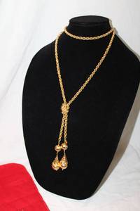 lot 378 image: Signed Kenneth J Lane 44L lariat style rope chain necklace  belt with filigree decorative dangles. In KJL pouch (can be used as both necklace or belt per website)