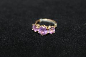 lot 384 image: 10K yellow gold Amethyst 3-stone past, present, future ring. Marked 10K. Size 6-6.5 Amethyst tested