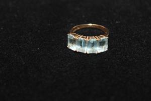 lot 364 image: 14K PLUMB yellow gold and Blue Topaz ring. Marked P 14K. Size 6. Blue Topaz tested. (14K plumb gold value (14KP) is guaranteed to contain 58.33% gold or more.)