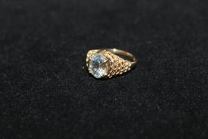 lot 368 image: 14K yellow gold Aquamarine ring. Marked 14K. Gemstone tested as Aquamarine but please verify at preview. Size 7