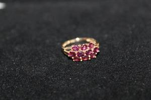 lot 371 image: 14K yellow gold purple Garnet ring. Marked 14K JED. Size 7. Garnet tested.