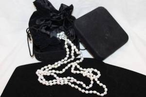 lot 416 image: Cultured freshwater pearl strand 58L. End needs reattached or clasp. Quality opera length pearls. With storage pouch and box.
