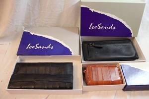 lot 436 image: Lee Sands branded leather walletsclutch. 2 are eel skin. In original boxes.