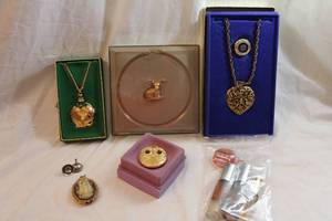 lot 442 image: Solid and liquid perfumes. Includes solid perfumes in heart, elephant and deer forms. Intimate, Moon Drops The Rajahs Elephant, Charlie, Mistletoe, Jontue, Dune plus. Also includes (2) perfume funnels.