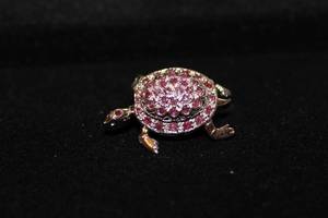 lot 477 image: Sterling Silver and Pink Spinel pave broochpin with articulated head and legs. Marked sterling. 1.5L Spinel tested