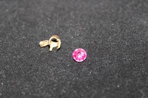 lot 487 image: 10K yellow gold pendant mount (Appears to be marked 10K) and Pink Spinel round Approx 1.0 carat 6.5mm Please verify at preview.