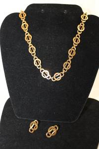lot 489 image: Gold Filled reproduction Metropolitan Museum of Art (MMA) CLEO 1992 woven concentric link necklace and poststud earring demi parure. Marked 1992 MMA CLEO. Scarce.