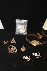 lot 491 image: 10K Gold Filled jewelry. One anchor enamel pin has (4) diamonds. Diamonds tested.
